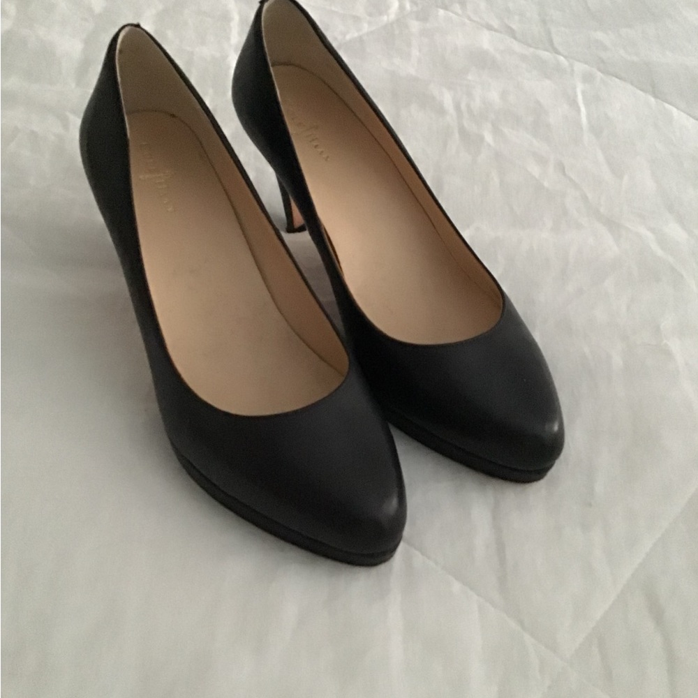 Cole Haan black leather pumps.